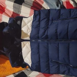 Vest with detachable hood and reversible